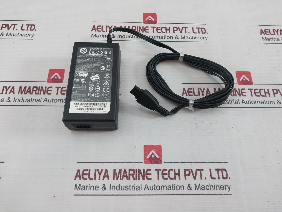 Hp 0957-2304 Ac Power Adapter Rev.: B 100-240V 50/60Hz 0.9A 1094Ma/250Ma