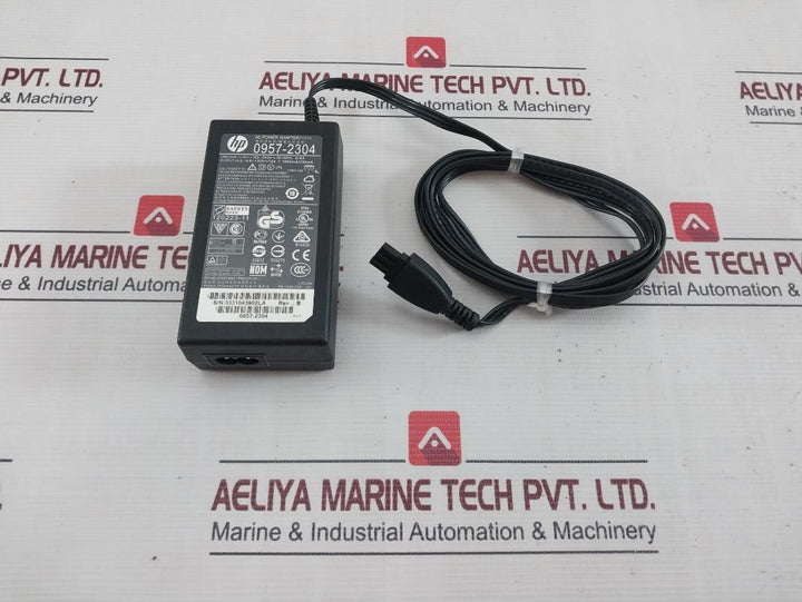 Hp 0957-2304 Ac Power Adapter Rev.: B 100-240V 50/60Hz 0.9A 1094Ma/250Ma