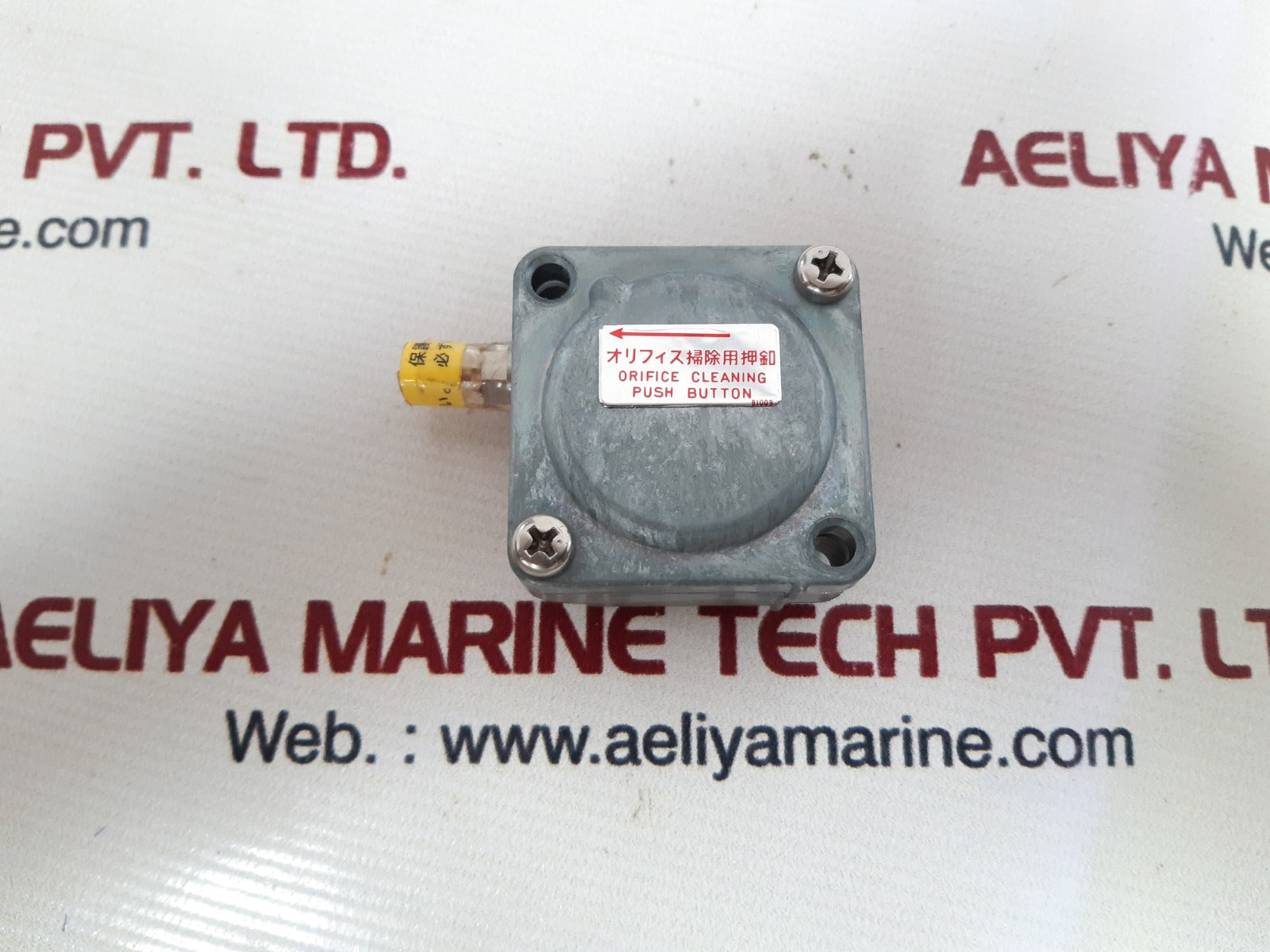 Orifice cleaning push button