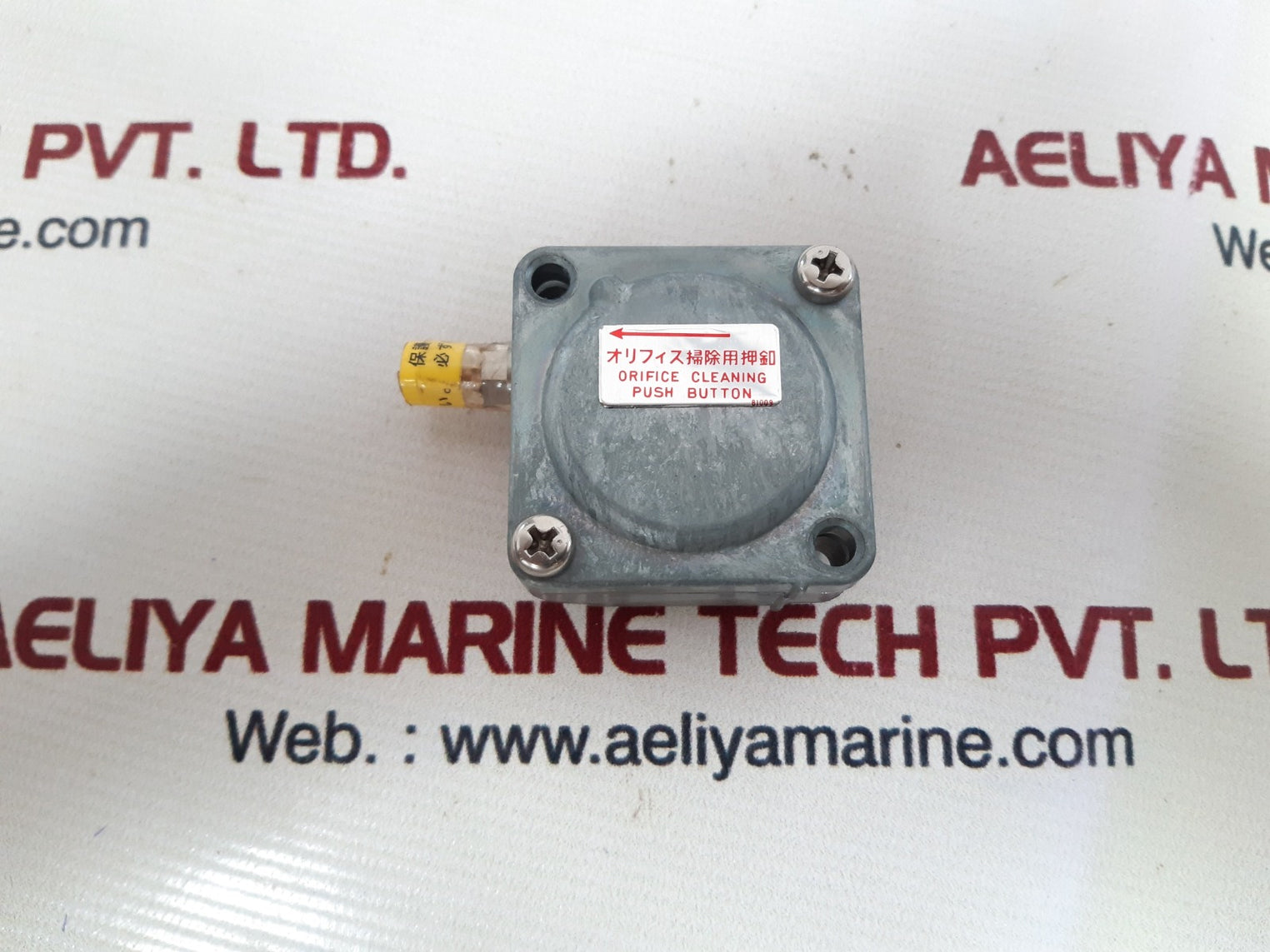 Orifice cleaning push button